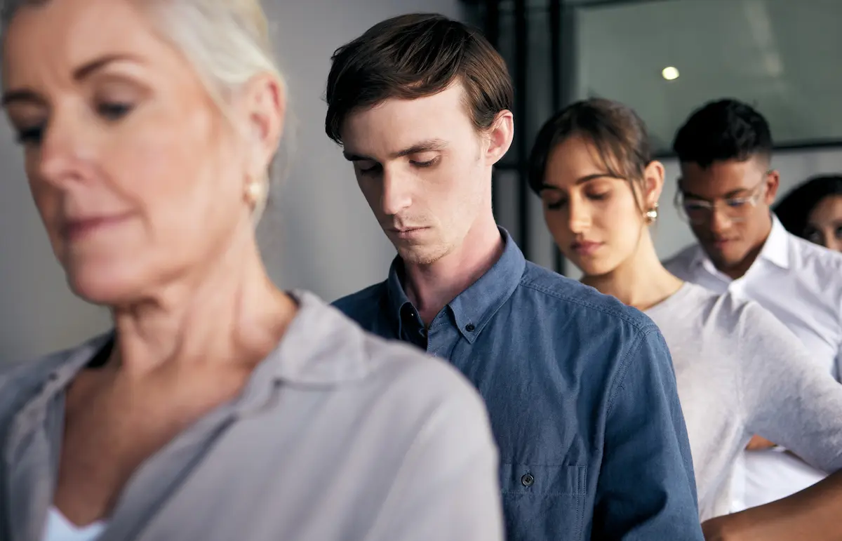 People stand in line and demonstrate the widespread issue of mental health.
