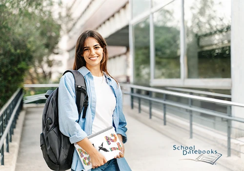 A student holding a datebook