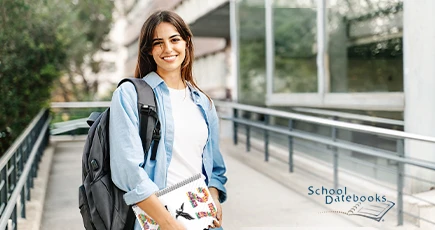 A student holding a datebook