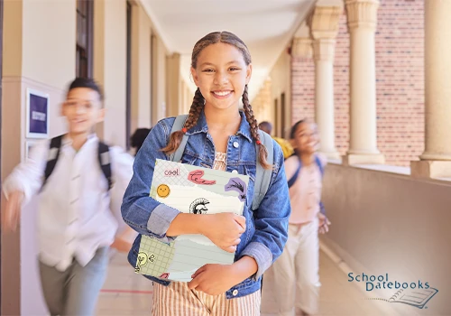 A young female student holding a personalized folder