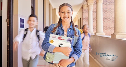A young female student holding a personalized folder
